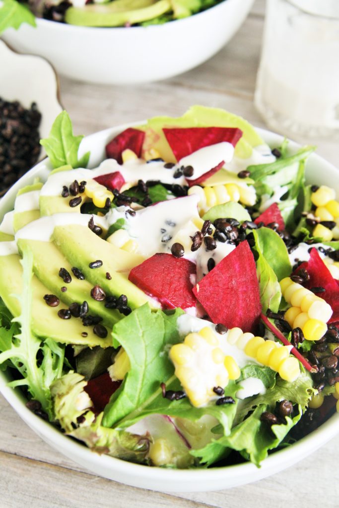 This delicious salad is loaded with superfood ingredients such as avocado, corn, beets, and baby spinach tossed in a creamy lemon tahini dressing - light yet hearty enough for lunch or dinner!