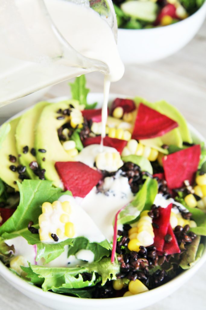 This delicious salad is loaded with superfood ingredients such as avocado, corn, beets, and baby spinach tossed in a creamy lemon tahini dressing - light yet hearty enough for lunch or dinner!