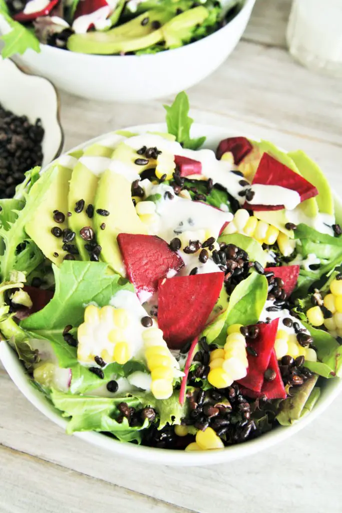 This delicious salad is loaded with superfood ingredients such as avocado, corn, beets, and baby spinach tossed in a creamy lemon tahini dressing - light yet hearty enough for lunch or dinner!