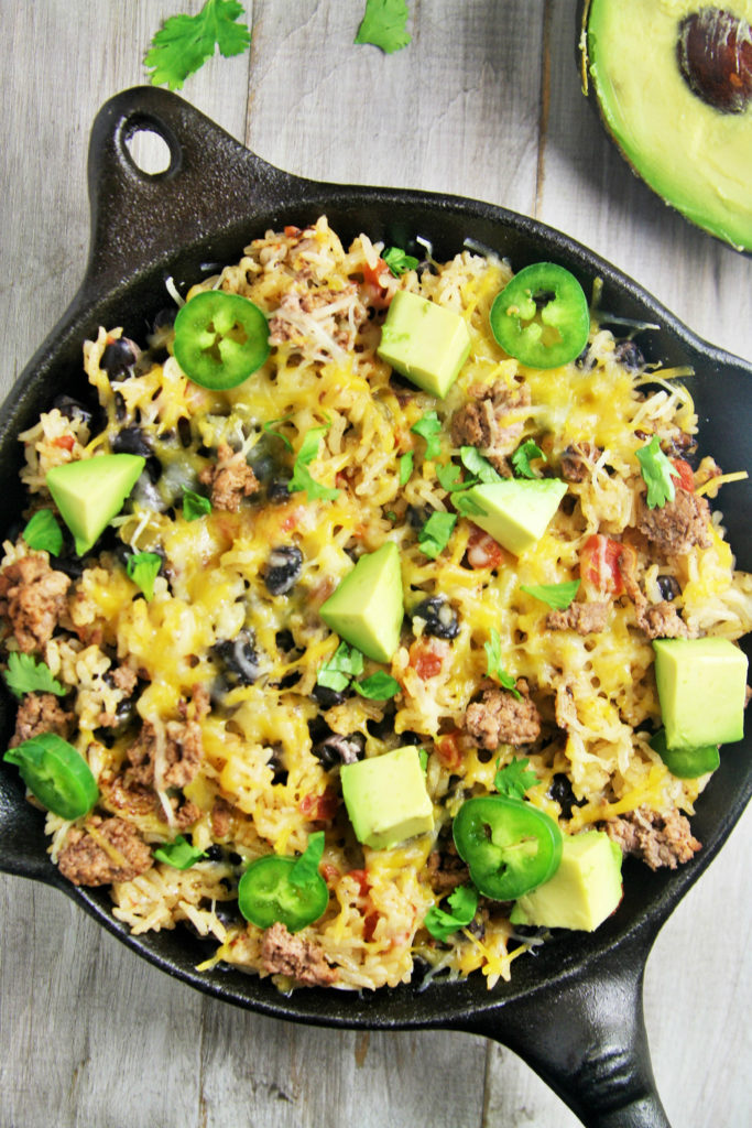 This easy, delicious rice skillet filled with burrito ingredients is sure to be a hit at your next fiesta or weeknight dinner.