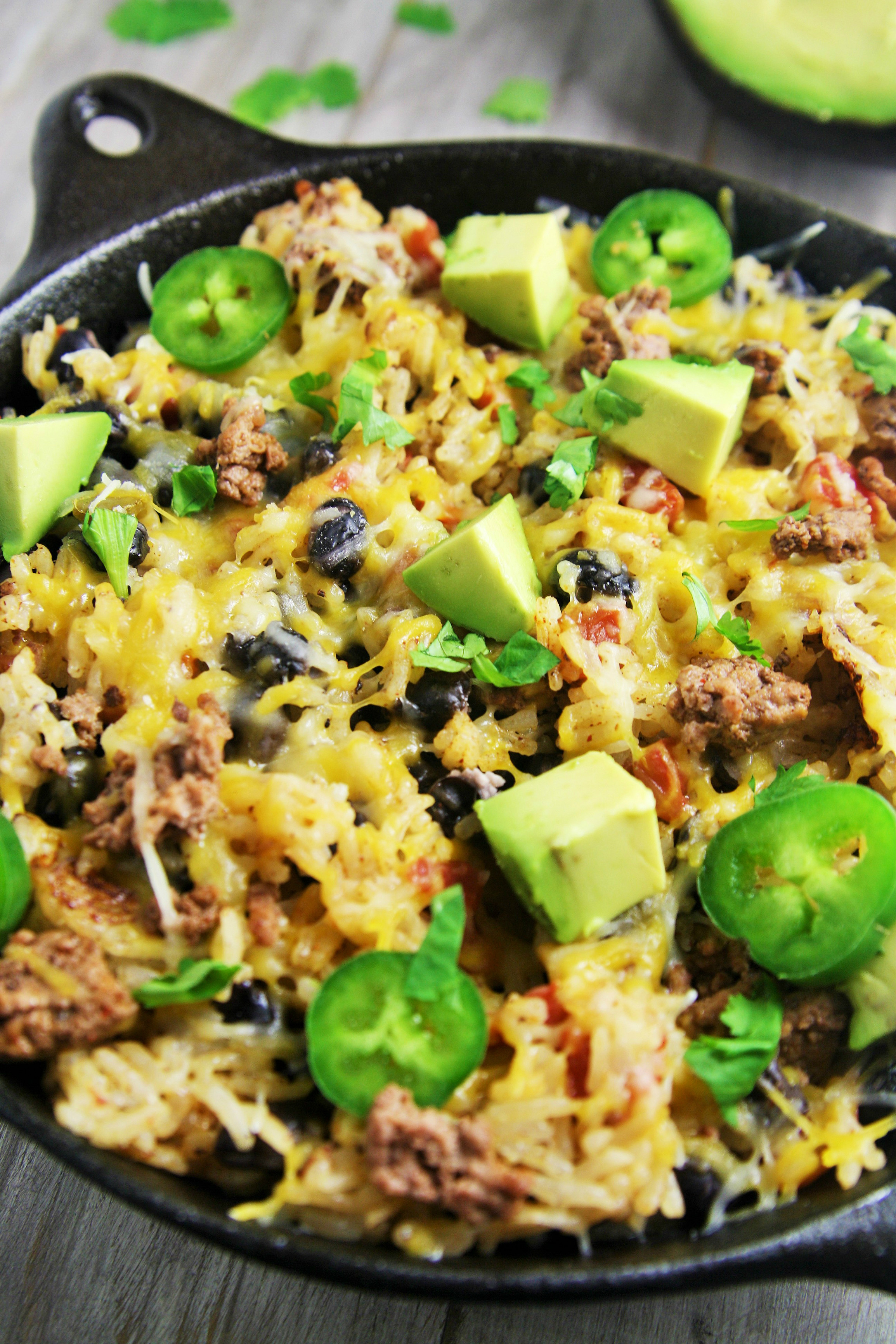 This easy, delicious rice skillet filled with burrito ingredients is sure to be a hit at your next fiesta or weeknight dinner.