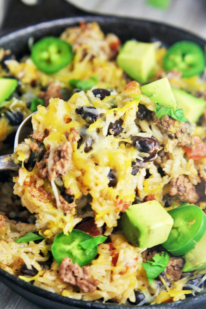 This easy, delicious rice skillet filled with burrito ingredients is sure to be a hit at your next fiesta or weeknight dinner.