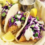Crispy Fish Tacos with Cabbage Slaw and Lime Crema