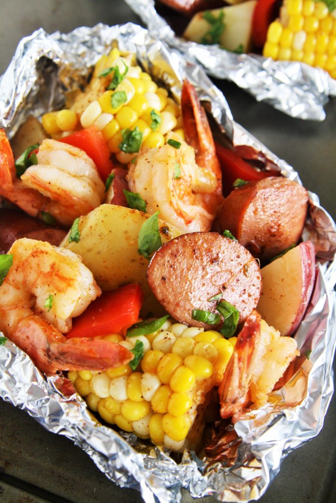 Whether you want an easy weeknight meal at home or looking for a great recipe for the grill, these Cajun Sausage and Shrimp Boil Foil Packets have got you covered. 