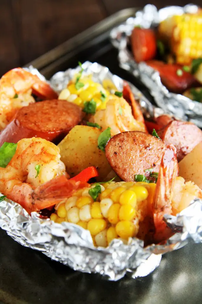 Whether you want an easy weeknight meal at home or looking for a great recipe for the grill, these Cajun Sausage and Shrimp Boil Foil Packets have got you covered. 