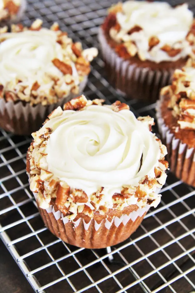 Made with banana, crushed pineapple, coconut and pecans, these Classic Hummingbird Cupcakes are moist, flavorful, and scrumptious.