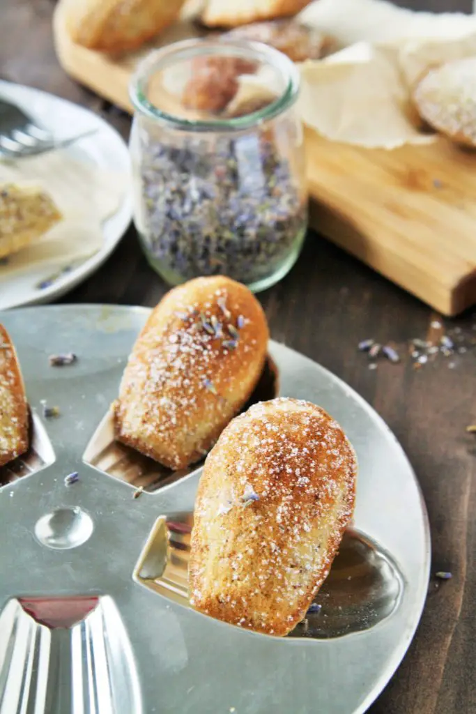 These almond madeleines are infused with the delicate flavors of lavender, honey, and lemon - enjoy with a cup of tea for relaxation. 