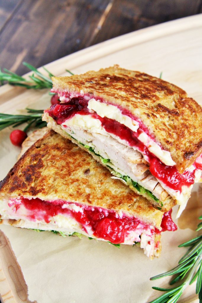 This Turkey and Brie Monte Cristo Sandwich is made with flavorful turkey breast, brie, cranberry sauce, and arugula - use up all those Thanksgiving leftovers or enjoy this all year round!