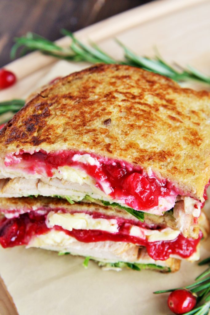 This Turkey and Brie Monte Cristo Sandwich is made with flavorful turkey breast, brie, cranberry sauce, and arugula - use up all those Thanksgiving leftovers or enjoy this all year round!