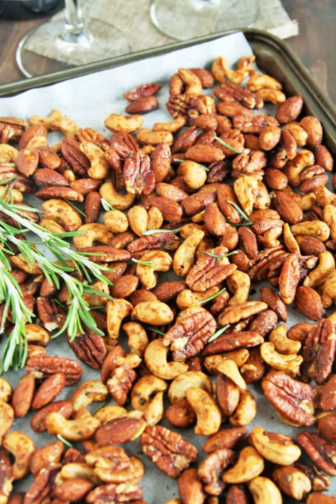 These Rosemary Honey Roasted Nuts are savory, sweet, and totally addicting thanks to the rosemary and cayenne pepper, with a touch of honey for sweetness.