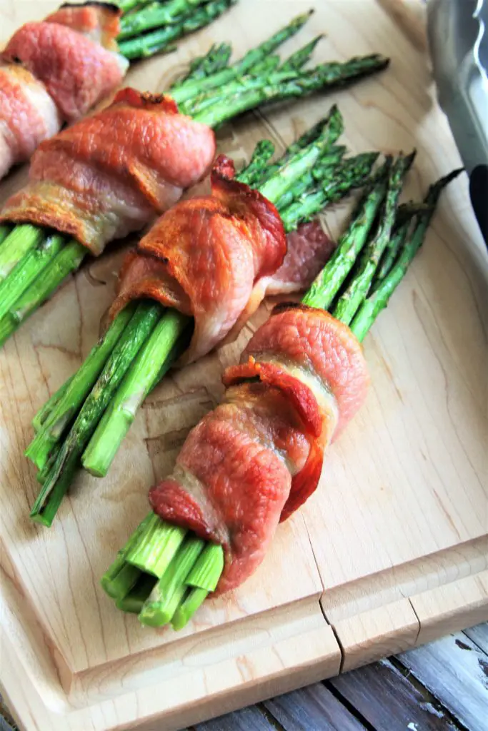 Bacon Wrapped Asparagus is an easy, elegant side dish that the whole family will love. Tender asparagus stalks are wrapped in ​thick-cut bacon and roasted to crispy perfection.