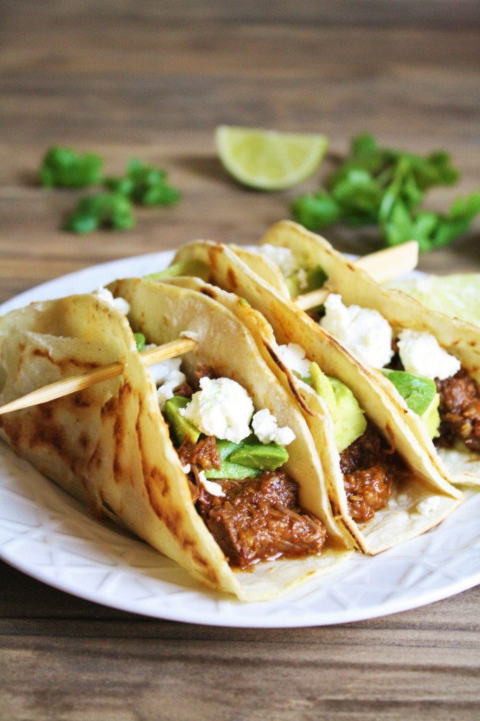 Cooked in the Instant Pot with chipotle peppers, spices, and beer until the meat becomes tender, this Instant Pot beef barbacoa recipe is the perfect filling for burritos, enchilada, tacos, and more! It's quick and easy - perfect for weeknight meal!