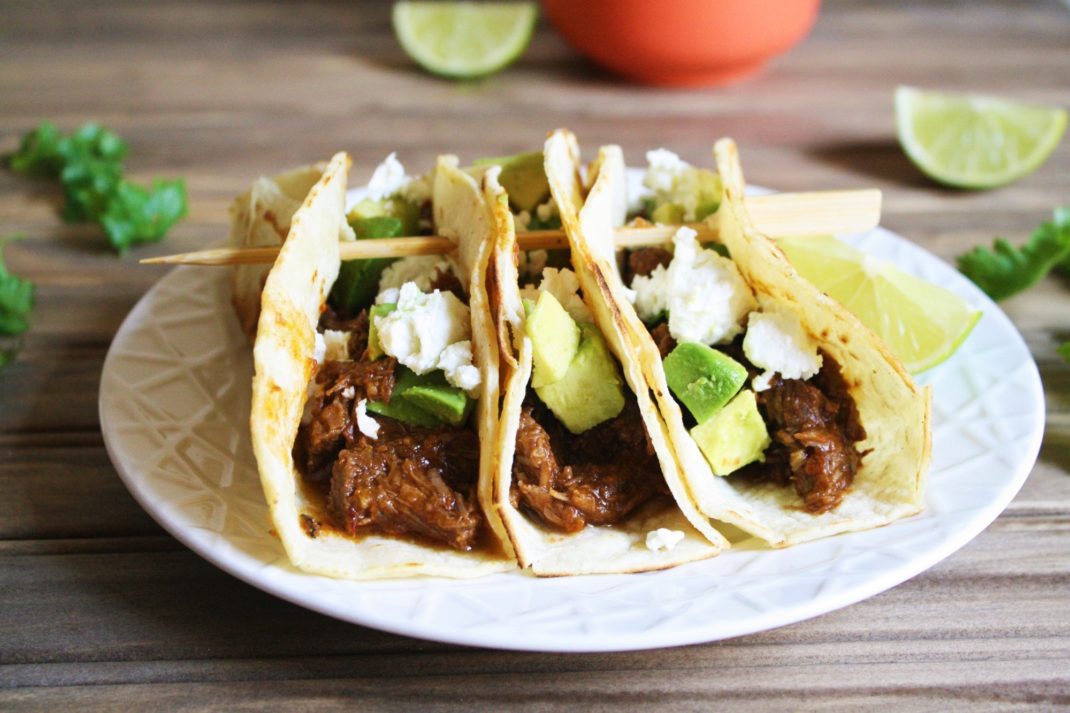 Cooked in the Instant Pot with chipotle peppers, spices, and beer until the meat becomes tender, this Instant Pot beef barbacoa recipe is the perfect filling for burritos, enchilada, tacos, and more! It's quick and easy - perfect for weeknight meal!