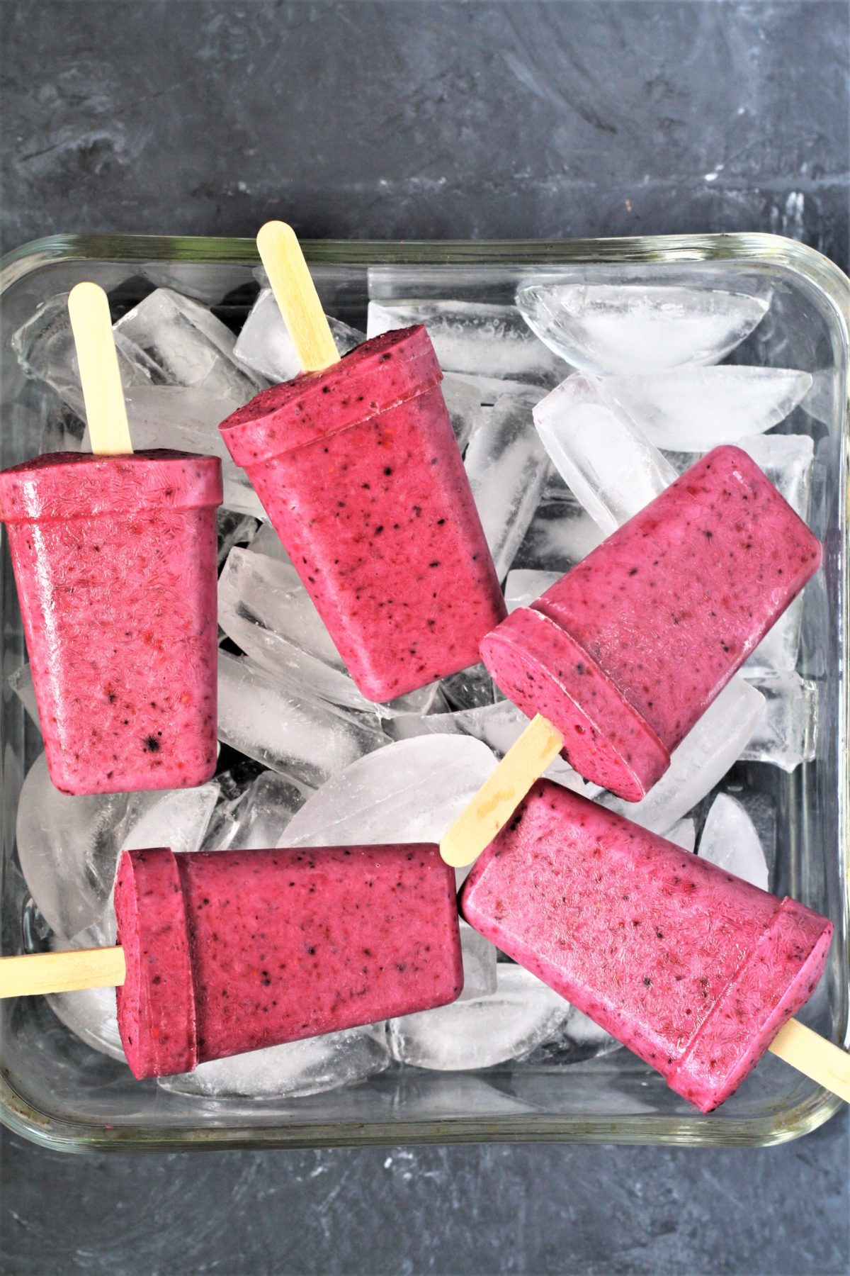 These healthy 3-Ingredient Berry Yogurt Popsicles are easy to make frozen treats that will keep you cool all summer long! 