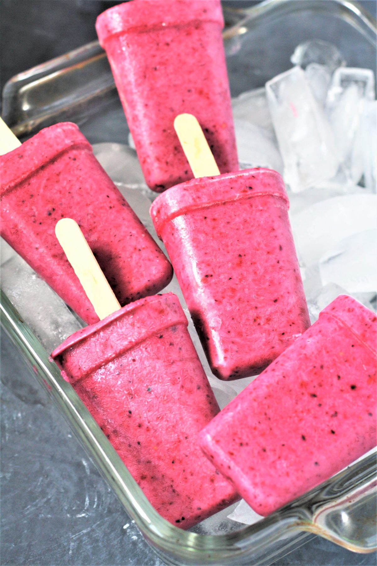 These healthy 3-Ingredient Berry Yogurt Popsicles are easy to make frozen treats that will keep you cool all summer long! 