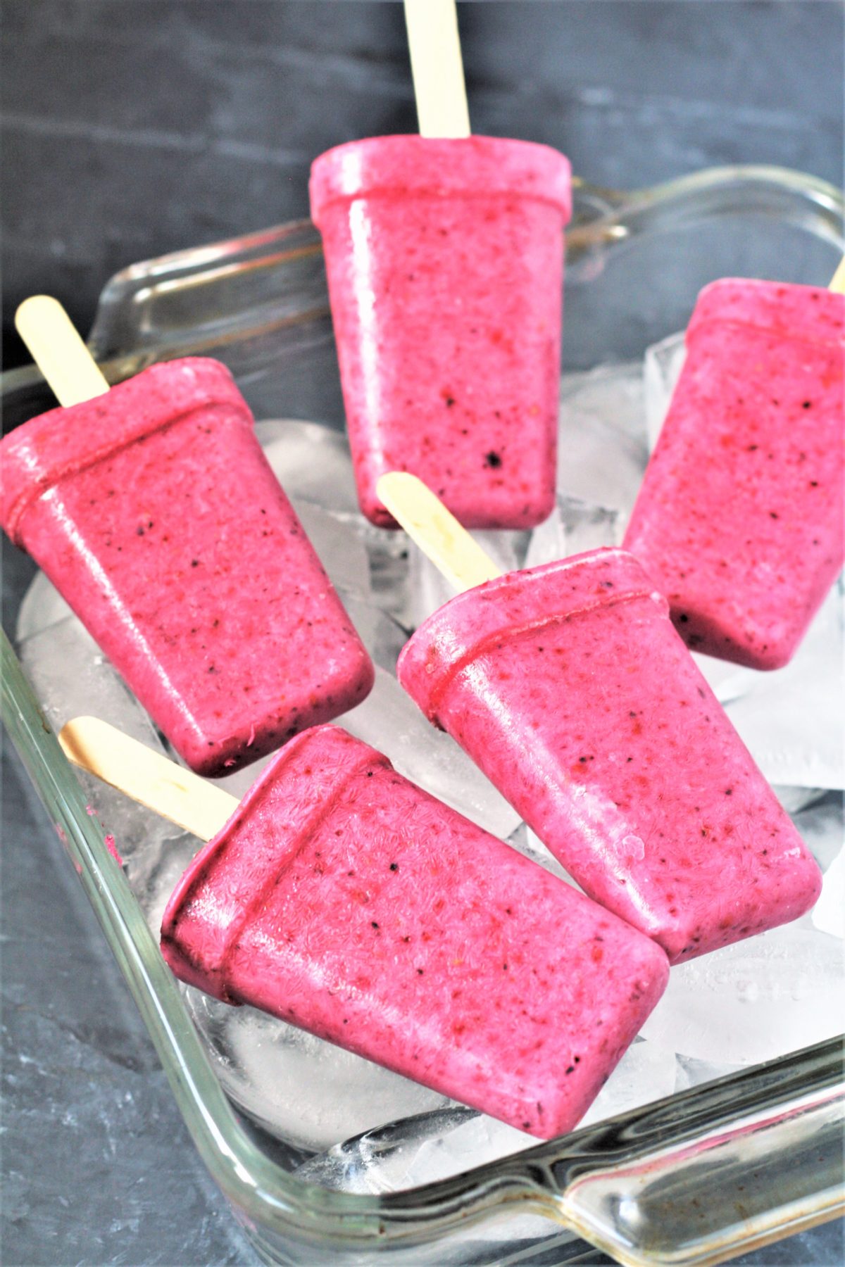 These healthy 3-Ingredient Berry Yogurt Popsicles are easy to make frozen treats that will keep you cool all summer long! 