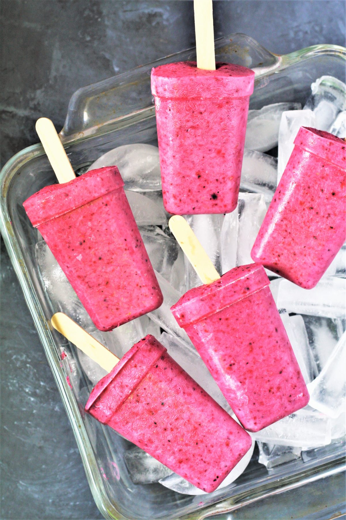 These healthy 3-Ingredient Berry Yogurt Popsicles are easy to make frozen treats that will keep you cool all summer long! 