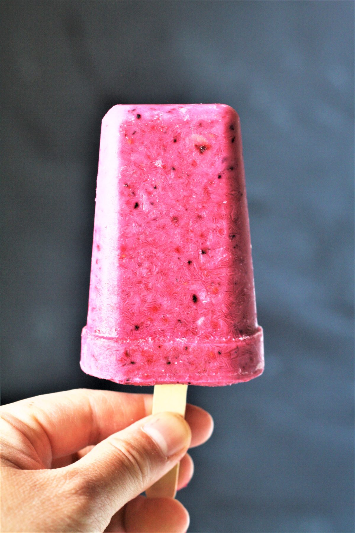 These healthy 3-Ingredient Berry Yogurt Popsicles are easy to make frozen treats that will keep you cool all summer long!