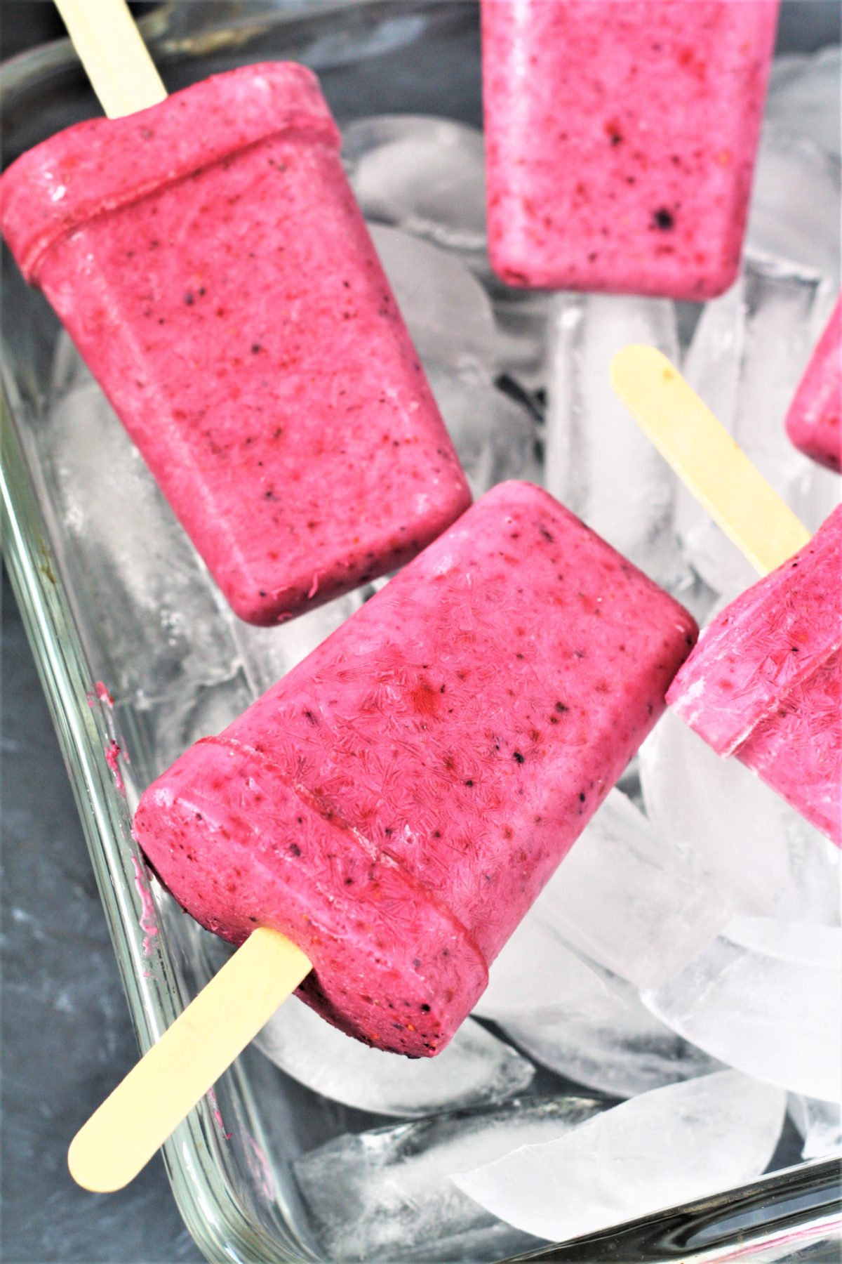 These healthy 3-Ingredient Berry Yogurt Popsicles are easy to make frozen treats that will keep you cool all summer long! 