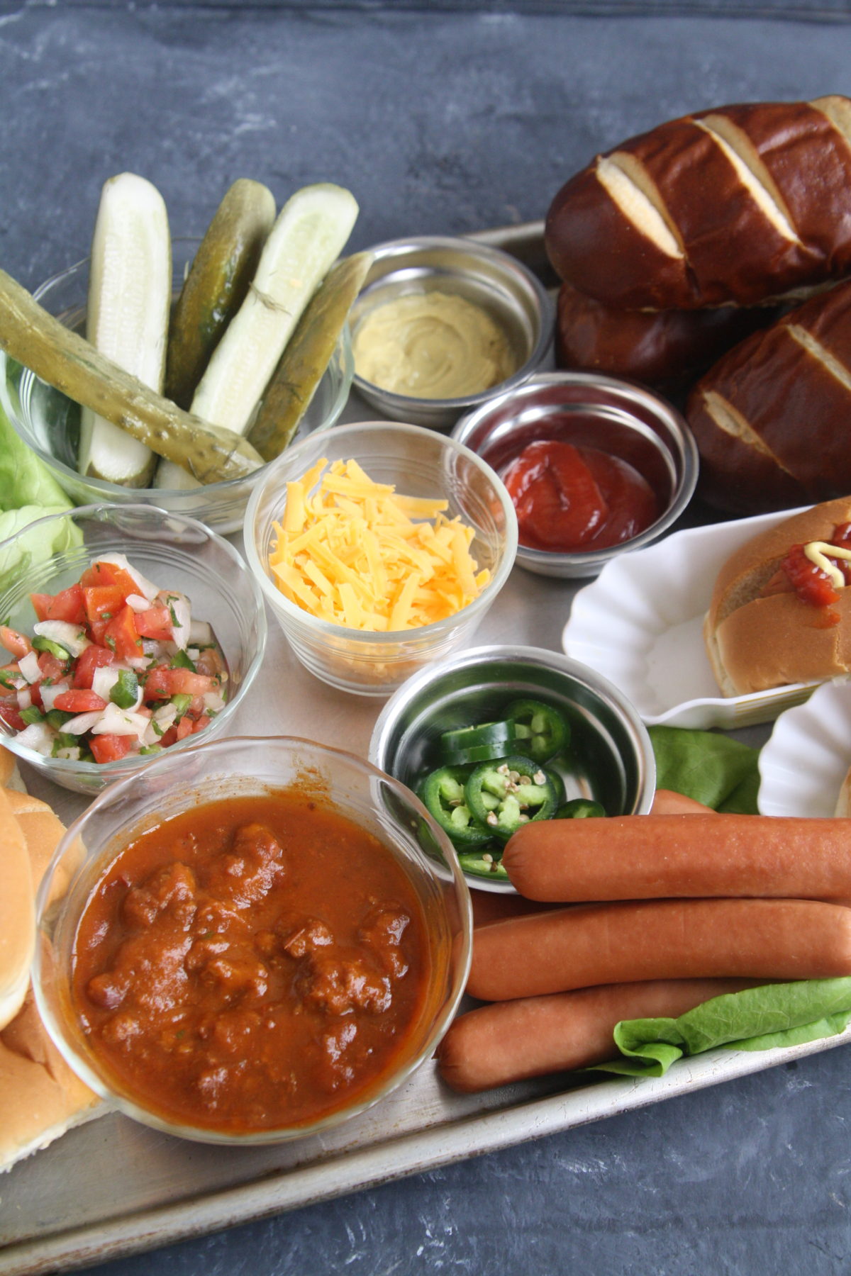 Take your next game day get together to the next level and serve this fun and delicious Build-Your-Own Hot Dog Charcuterie Grazing Boardfor an epic game day eats! 