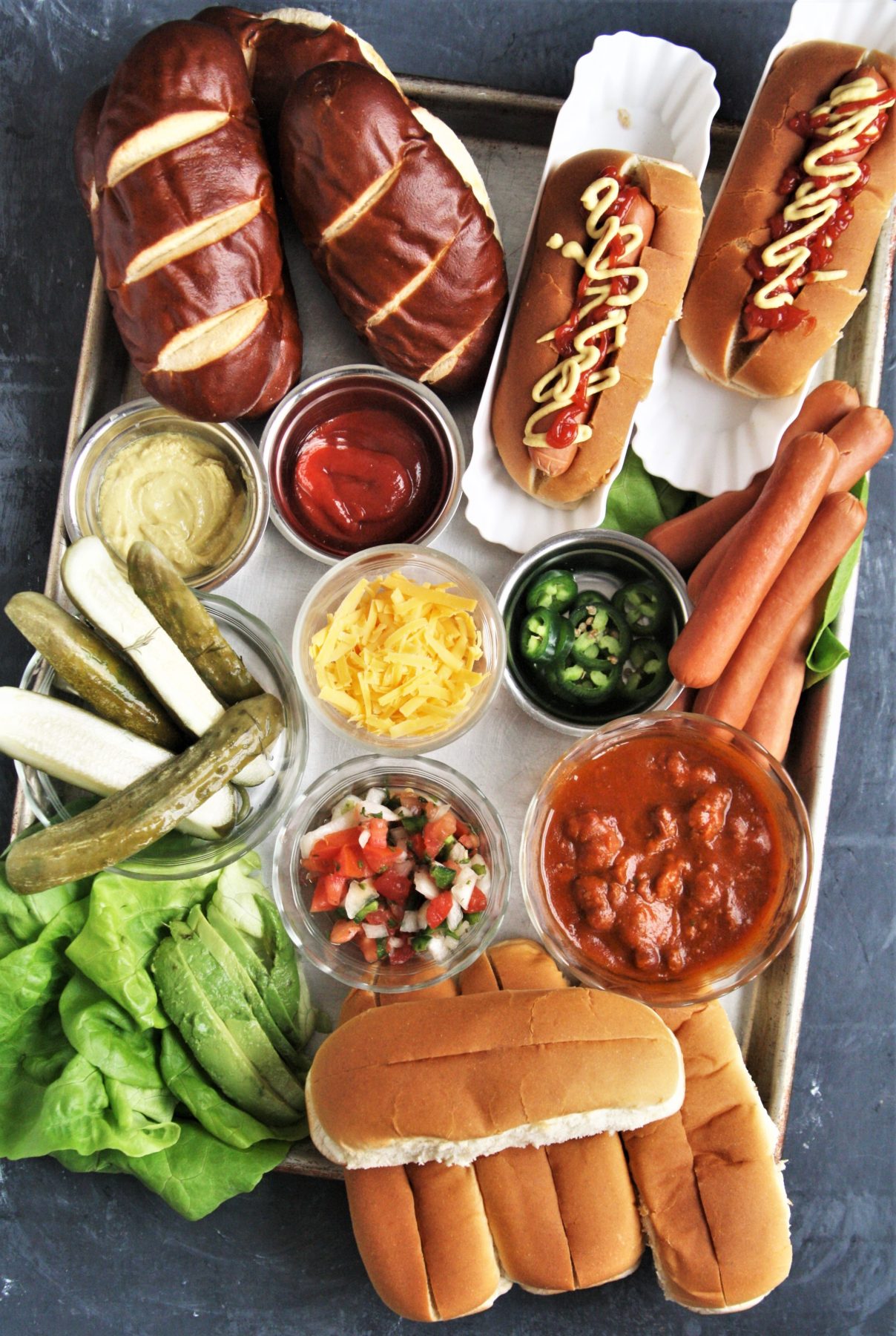 Take your next game day get together to the next level and serve this fun and delicious Build-Your-Own Hot Dog Charcuterie Grazing Boardfor an epic game day eats! 