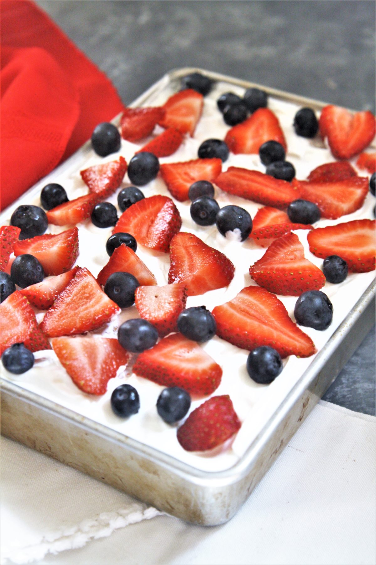 This no-bake Red, White, and Blue Icebox Cake is made with 5 simple ingredients, and is a patriotic dessert perfect for Memorial Day or Fourth of July!