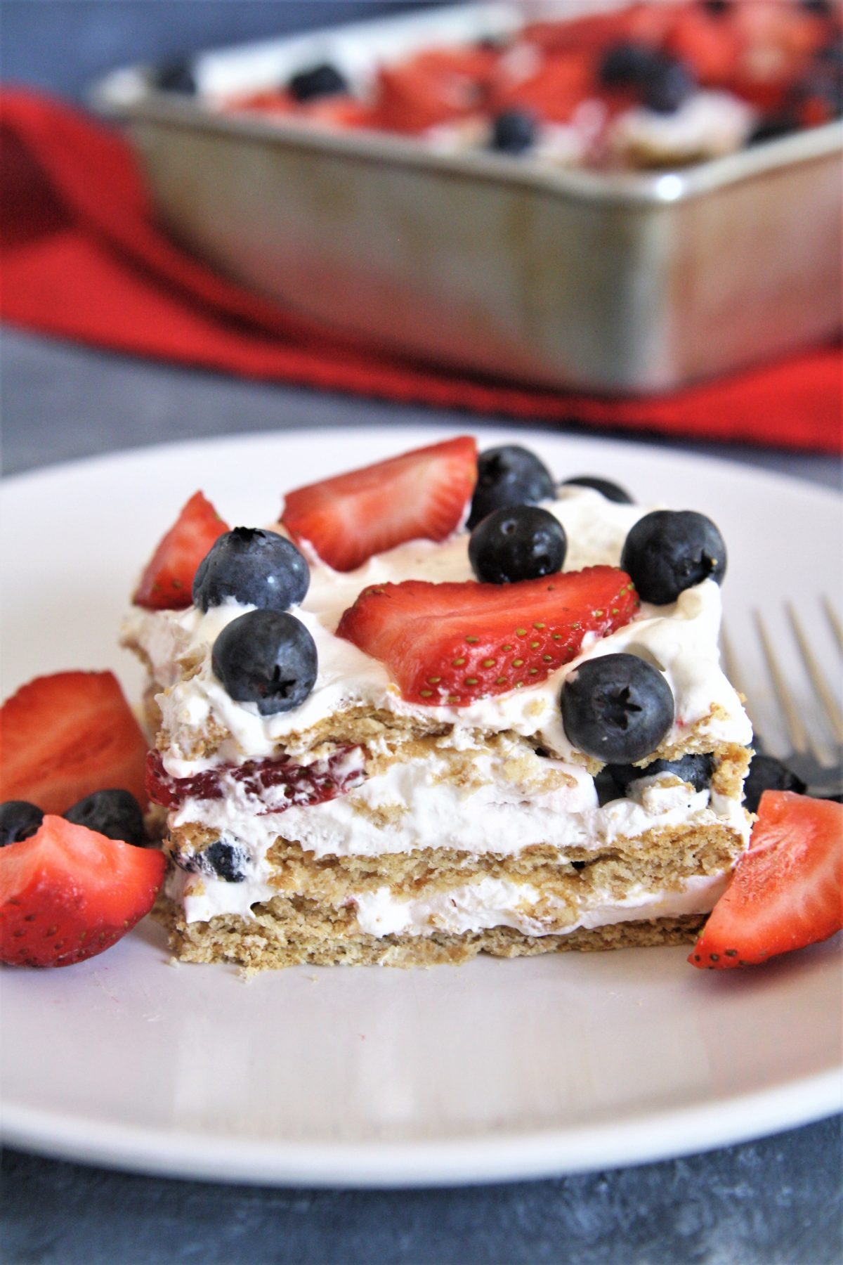 This no-bake Red, White, and Blue Icebox Cake is made with 5 simple ingredients, and is a patriotic dessert perfect for Memorial Day or Fourth of July!