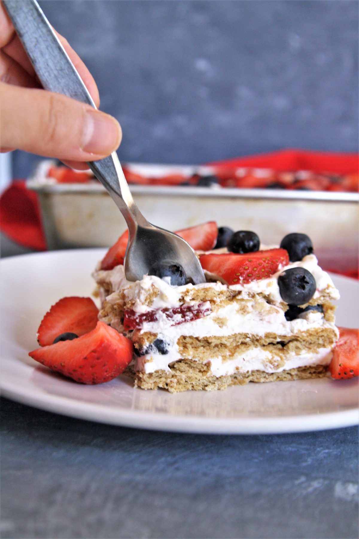 This no-bake Red, White, and Blue Icebox Cake is made with 5 simple ingredients, and is a patriotic dessert perfect for Memorial Day or Fourth of July!