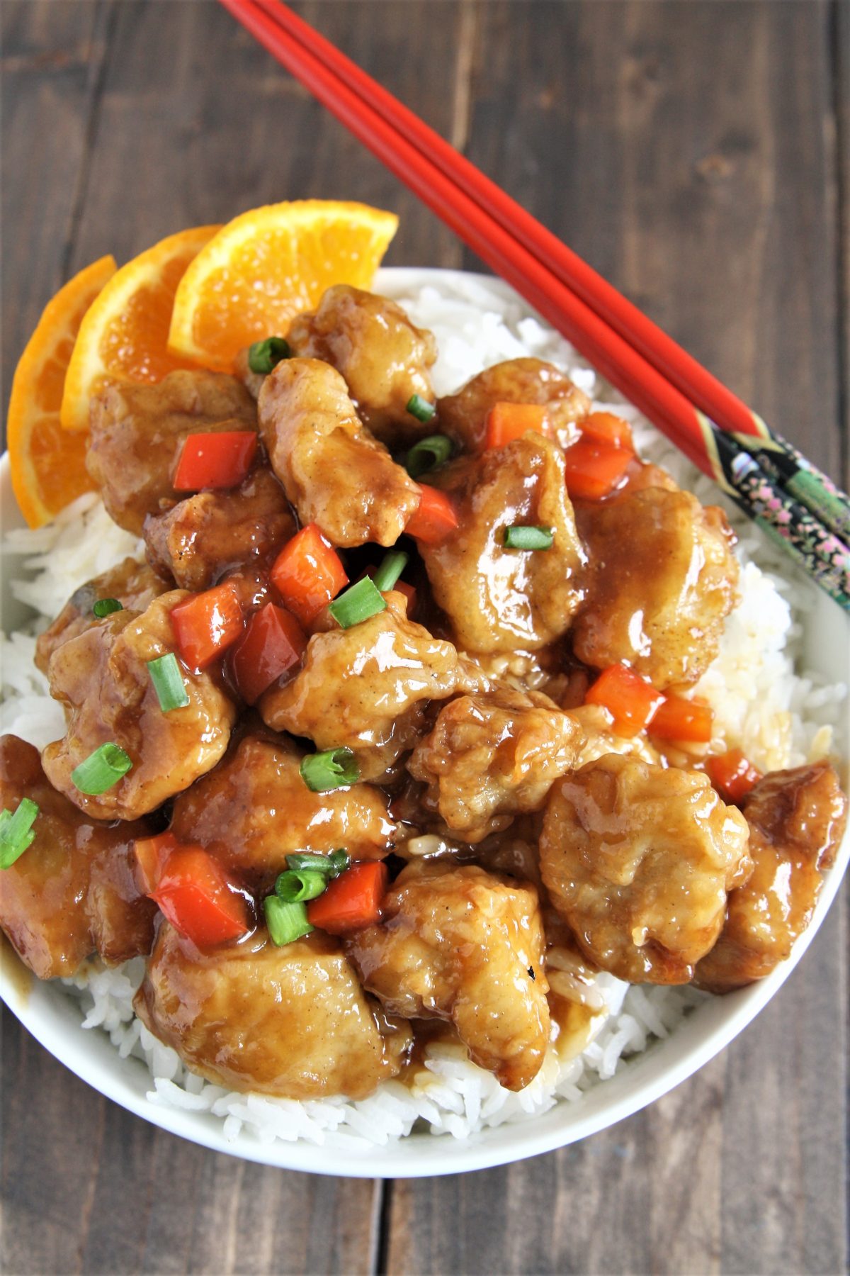 Crispy pieces of fried chicken coated in a delicious sweet and sticky orange sauce, this Panda Express Copycat Orange Chicken will become your new favorite weeknight dinner option!