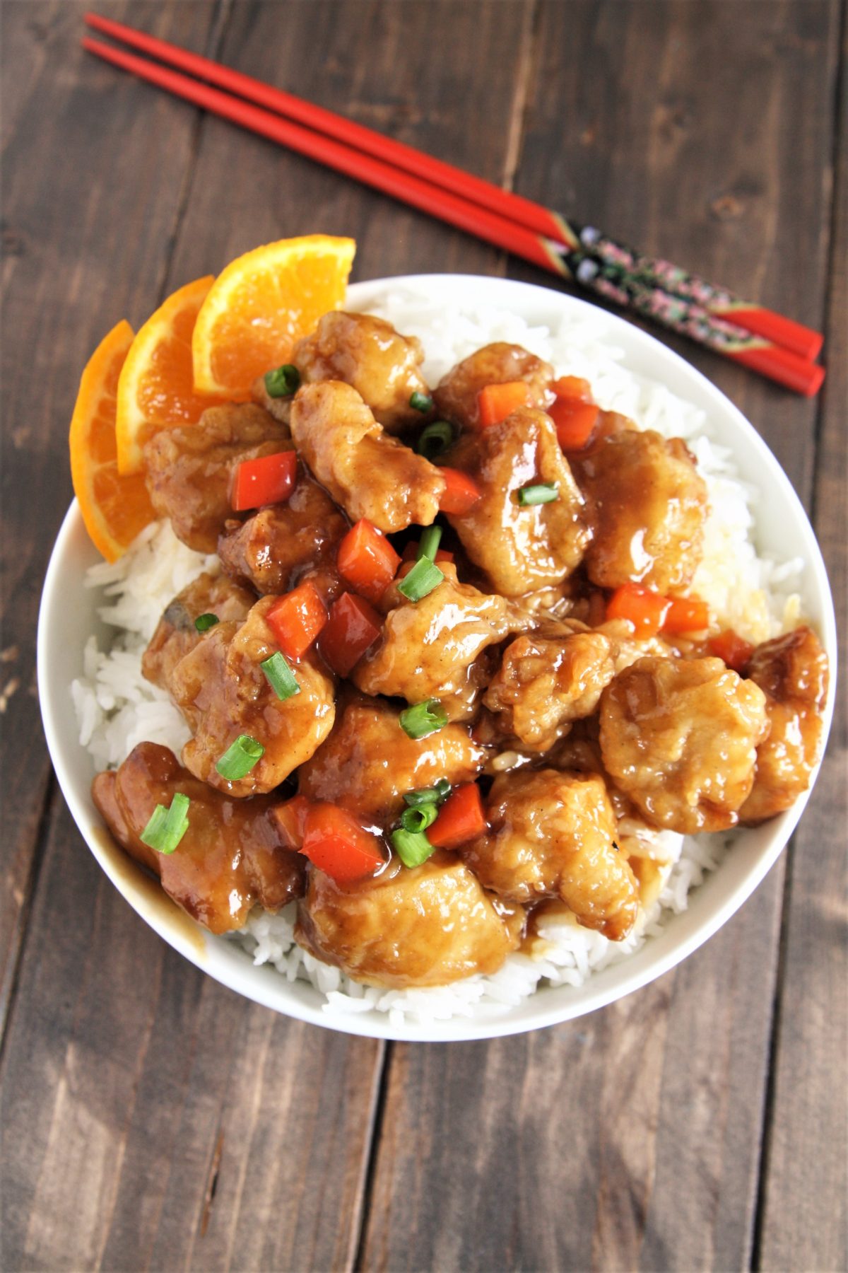 Crispy pieces of fried chicken coated in a delicious sweet and sticky orange sauce, this Panda Express Copycat Orange Chicken will become your new favorite weeknight dinner option!