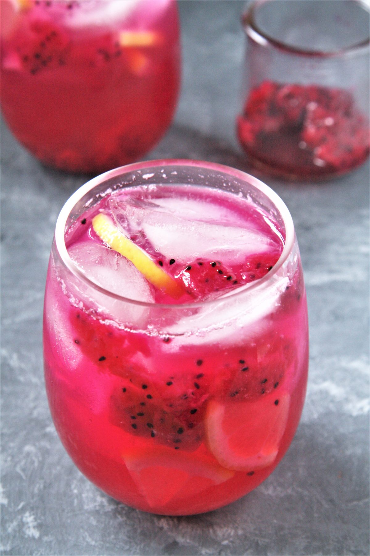 Featuring bold tropical flavors, this Starbucks Copycat Mango Dragonfruit Lemonade Refresher is a refreshing drink that you can make at home and enjoy all year round!