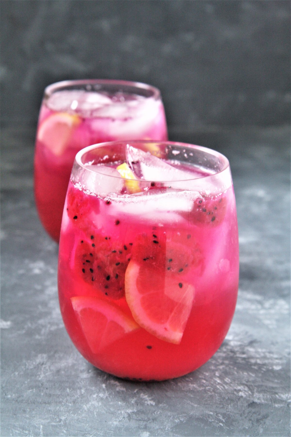 Featuring bold tropical flavors, this Starbucks Copycat Mango Dragonfruit Lemonade Refresher is a refreshing drink that you can make at home and enjoy all year round!