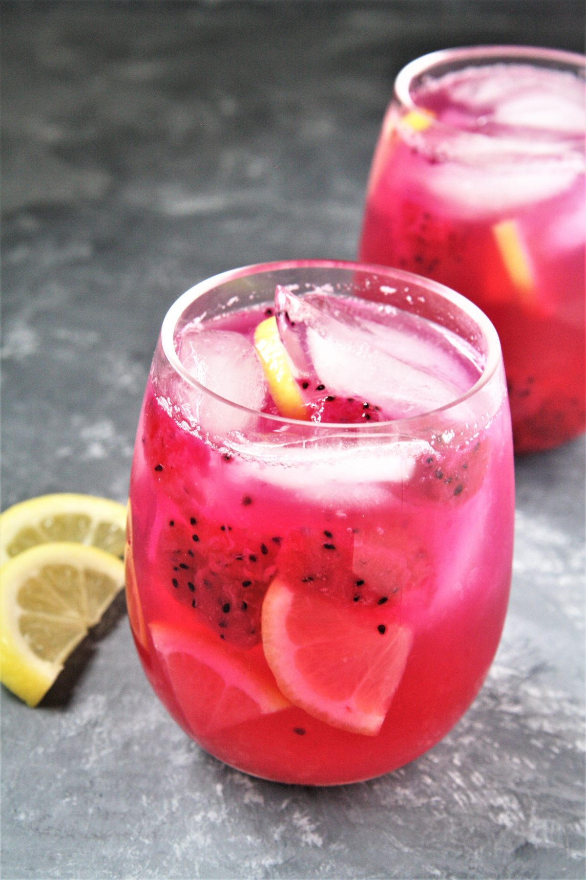 Featuring bold tropical flavors, this Starbucks Copycat Mango Dragonfruit Lemonade Refresher is a refreshing drink that you can make at home and enjoy all year round!