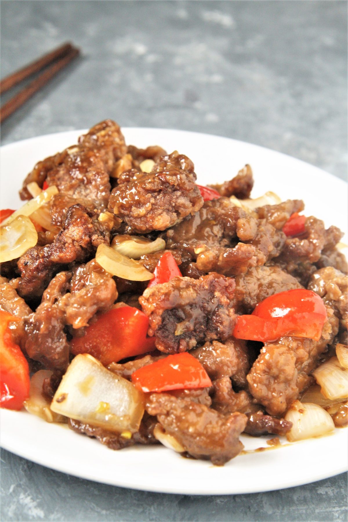 Crispy strips of beef tossed in an addictive sweet and spicy sauce with onions and peppers, this Panda Express Copycat Beijing Beef will become a dinner staple your family will love!
