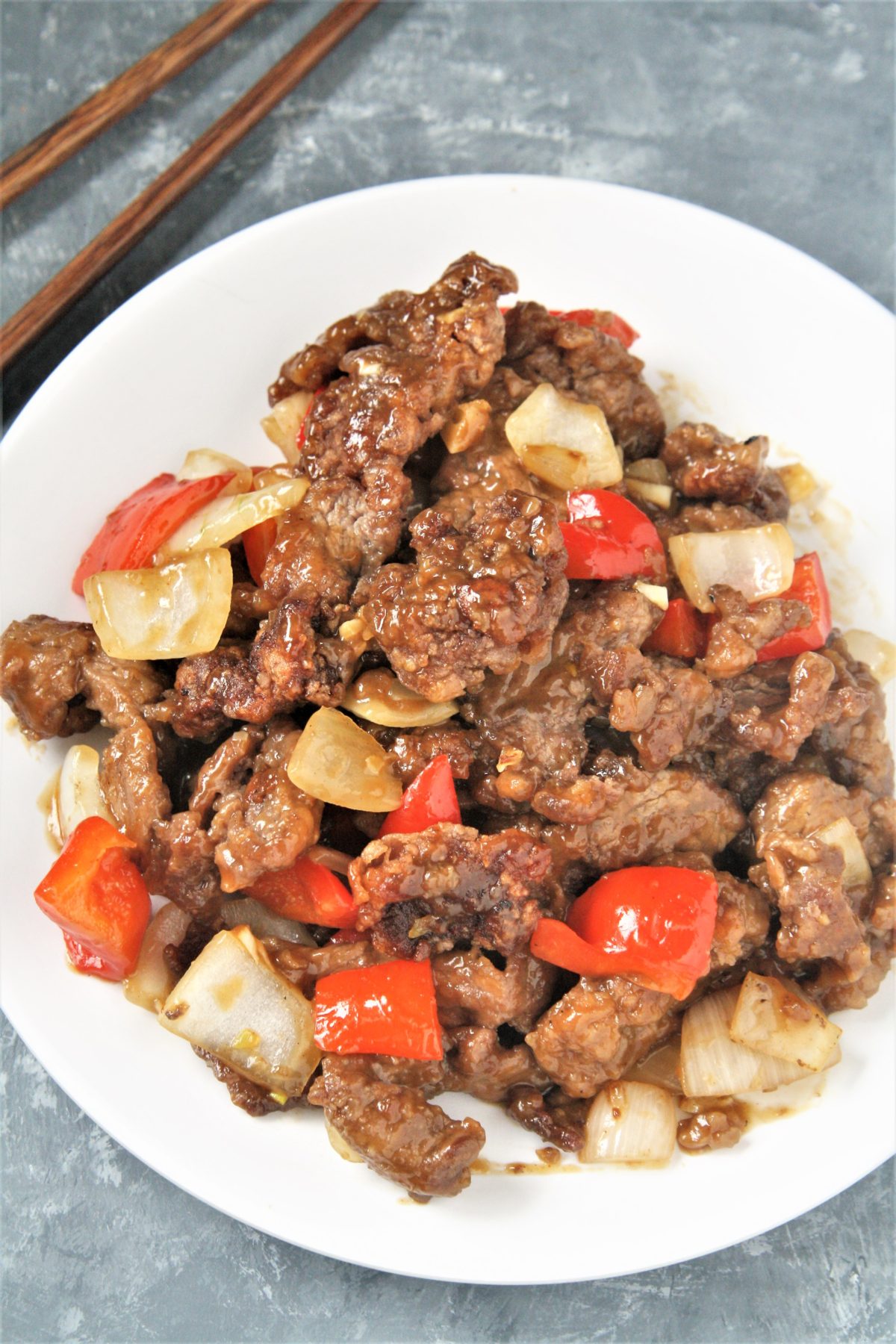 Crispy strips of beef tossed in an addictive sweet and spicy sauce with onions and peppers, this Panda Express Copycat Beijing Beef will become a dinner staple your family will love!