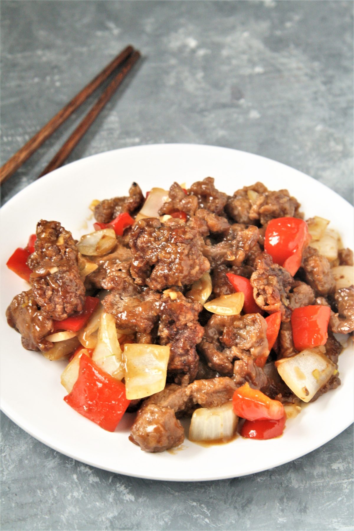 Crispy strips of beef tossed in an addictive sweet and spicy sauce with onions and peppers, this Panda Express Copycat Beijing Beef will become a dinner staple your family will love!