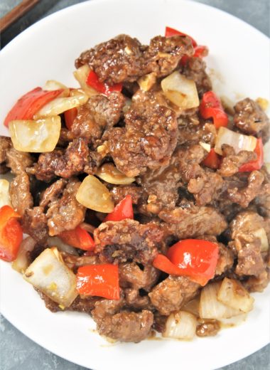 Crispy strips of beef tossed in an addictive sweet and spicy sauce with onions and peppers, this Panda Express Copycat Beijing Beef will become a dinner staple your family will love!