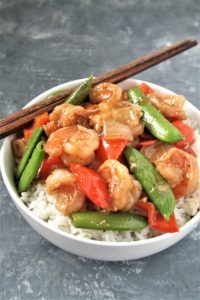 Tender shrimp wok fried in a sweet and spicy sauce with fresh veggies, this Panda Express Copycat Wok-Fried Shrimp recipe is going to quickly become your favorite go-to easy dinner! Serve over rice for a perfect weeknight meal.