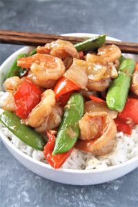 Tender shrimp wok fried in a sweet and spicy sauce with fresh veggies, this Panda Express Copycat Wok-Fried Shrimp recipe is going to quickly become your favorite go-to easy dinner! Serve over rice for a perfect weeknight meal.