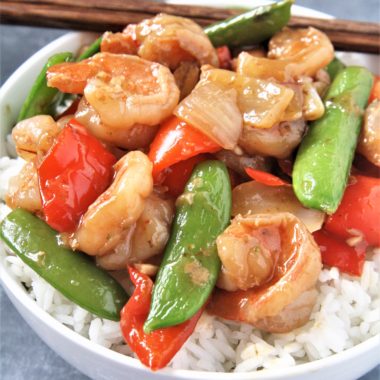 Tender shrimp wok fried in a sweet and spicy sauce with fresh veggies, this Panda Express Copycat Wok-Fried Shrimp recipe is going to quickly become your favorite go-to easy dinner! Serve over rice for a perfect weeknight meal.