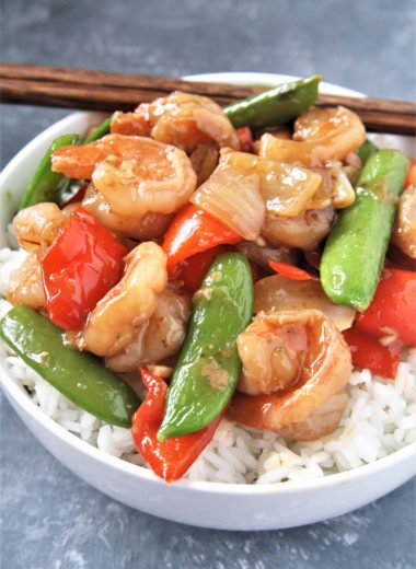 Tender shrimp wok fried in a sweet and spicy sauce with fresh veggies, this Panda Express Copycat Wok-Fried Shrimp recipe is going to quickly become your favorite go-to easy dinner! Serve over rice for a perfect weeknight meal.