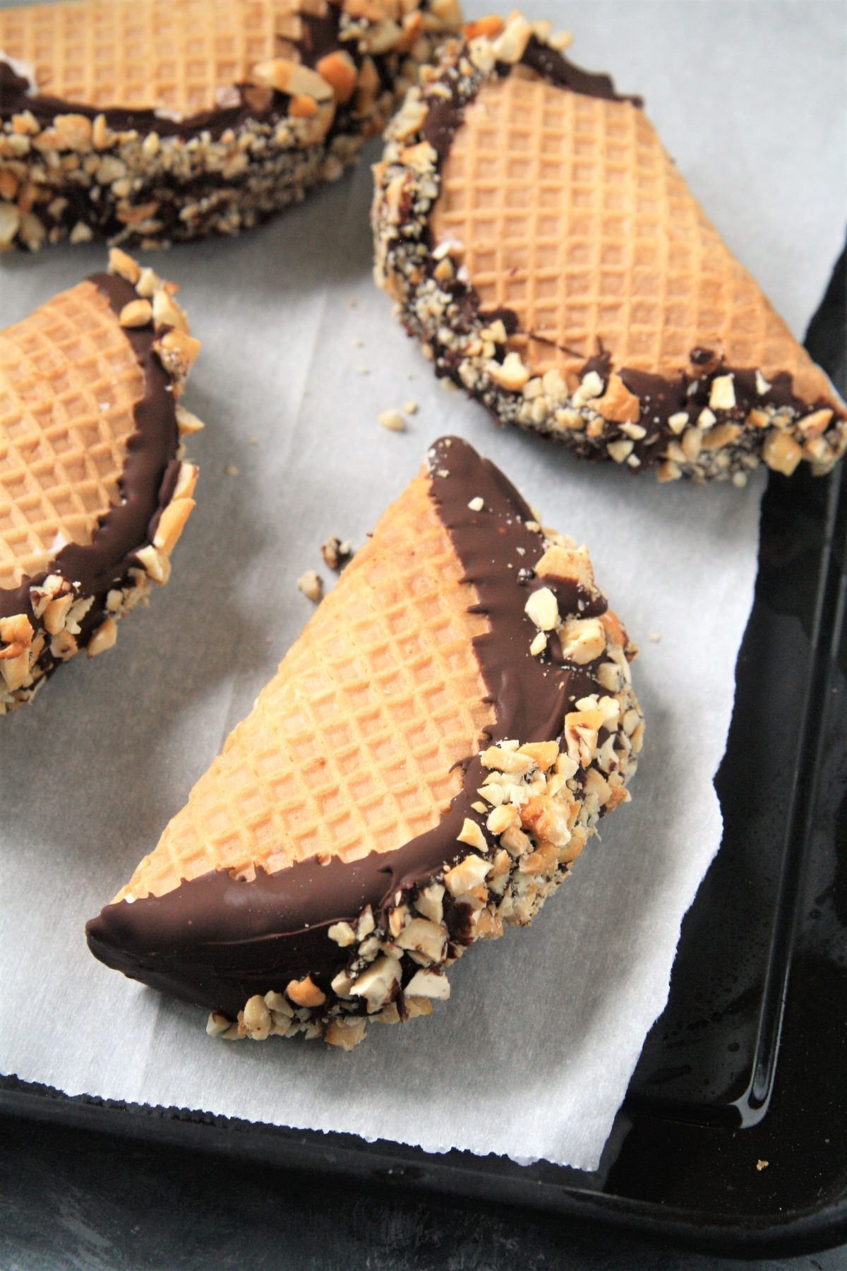 This homemade Choco Taco with taco-shaped waffle cone is filled with vanilla ice cream and topped with chocolate shell and peanuts, just like the iconic treat - the best part is it only requires 4 ingredients!