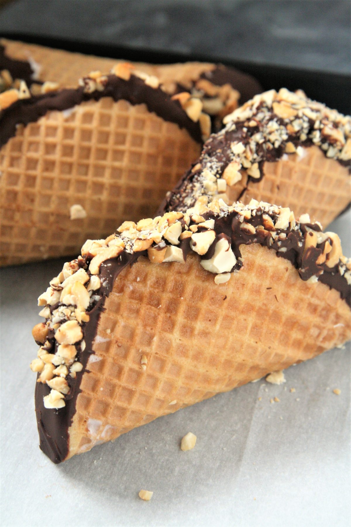 This homemade Choco Taco with taco-shaped waffle cone is filled with vanilla ice cream and topped with chocolate shell and peanuts, just like the iconic treat - the best part is it only requires 4 ingredients!