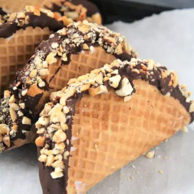 This homemade Choco Taco with taco-shaped waffle cone is filled with vanilla ice cream and topped with chocolate shell and peanuts, just like the iconic treat - the best part is it only requires 4 ingredients!