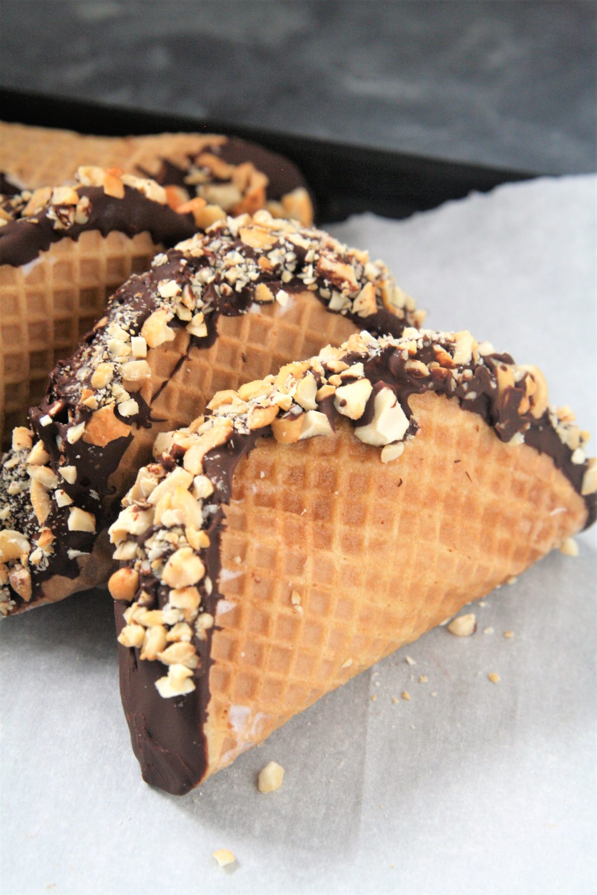 This homemade Choco Taco with taco-shaped waffle cone is filled with vanilla ice cream and topped with chocolate shell and peanuts, just like the iconic treat - the best part is it only requires 4 ingredients!