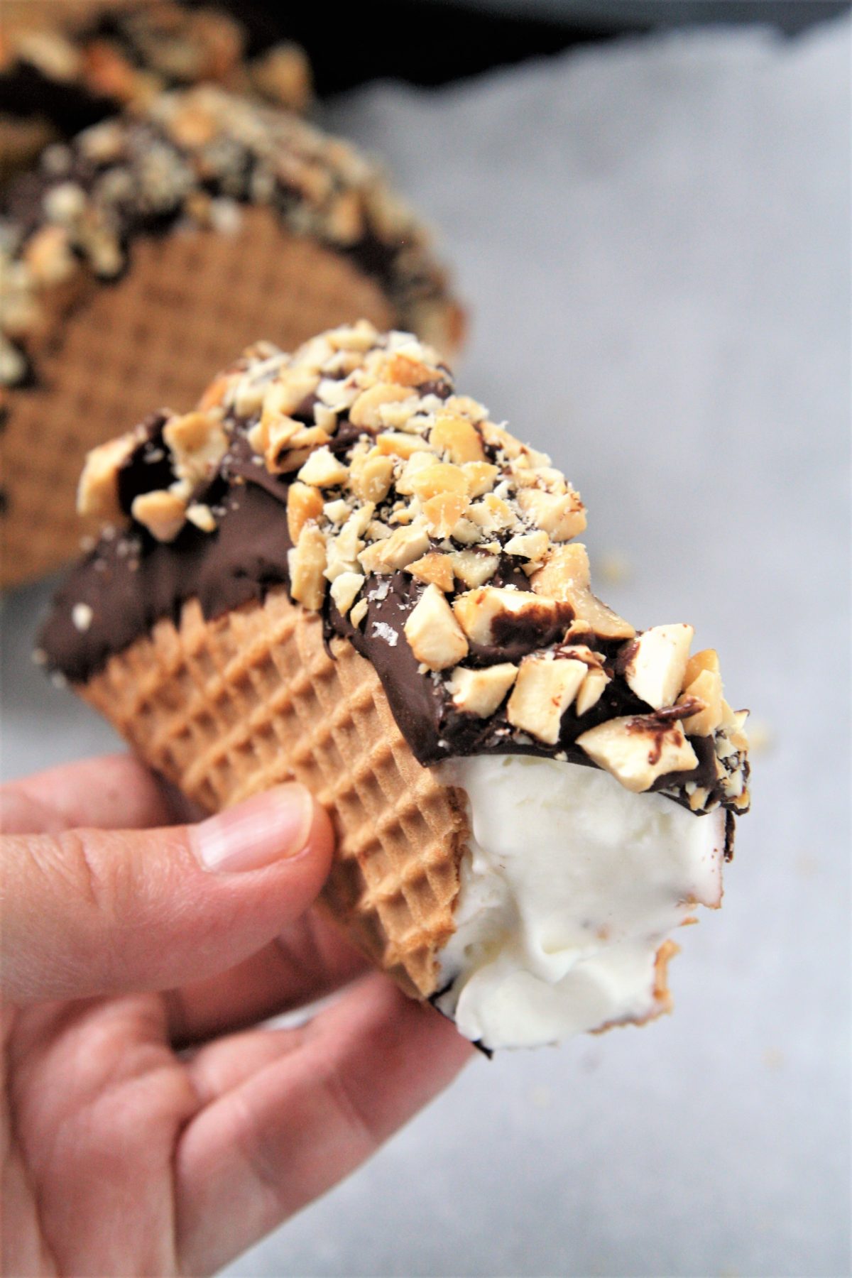 This homemade Choco Taco with taco-shaped waffle cone is filled with vanilla ice cream and topped with chocolate shell and peanuts, just like the iconic treat - the best part is it only requires 4 ingredients!