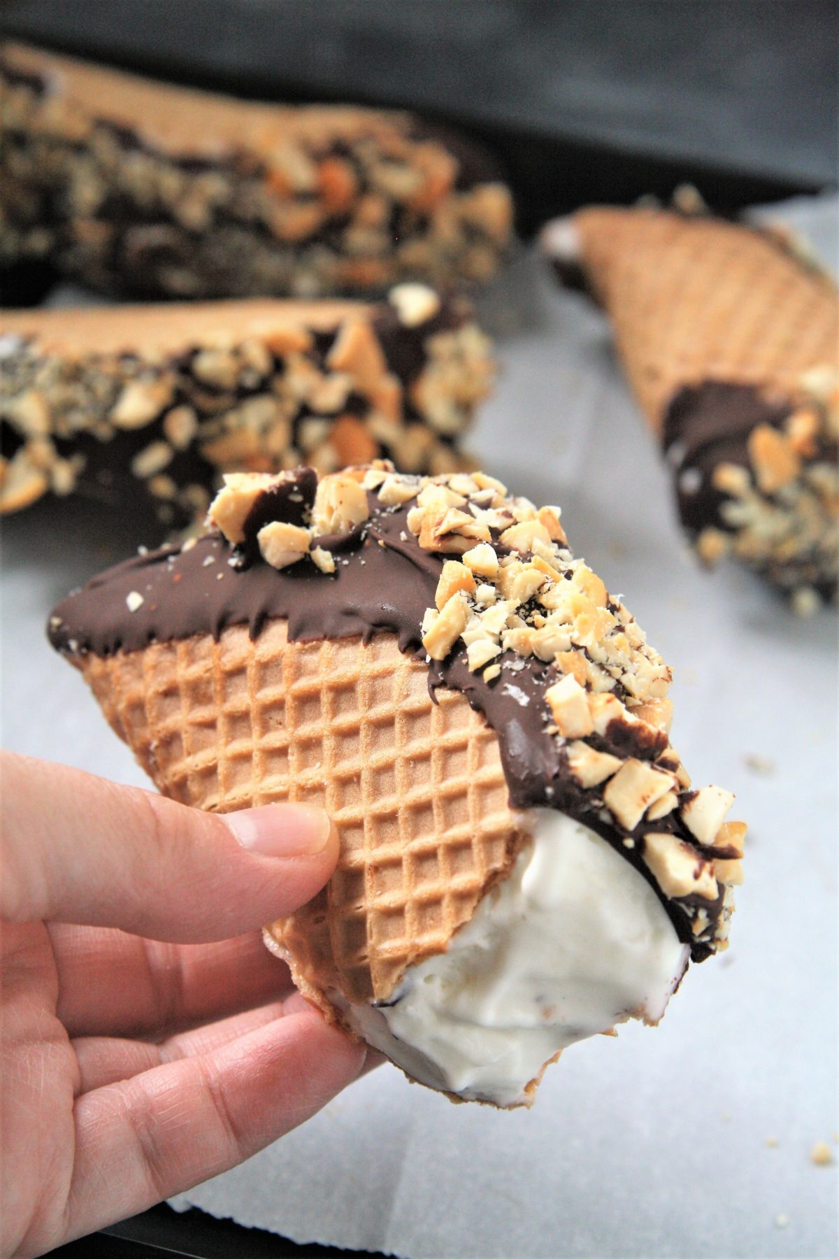 This homemade Choco Taco with taco-shaped waffle cone is filled with vanilla ice cream and topped with chocolate shell and peanuts, just like the iconic treat - the best part is it only requires 4 ingredients!