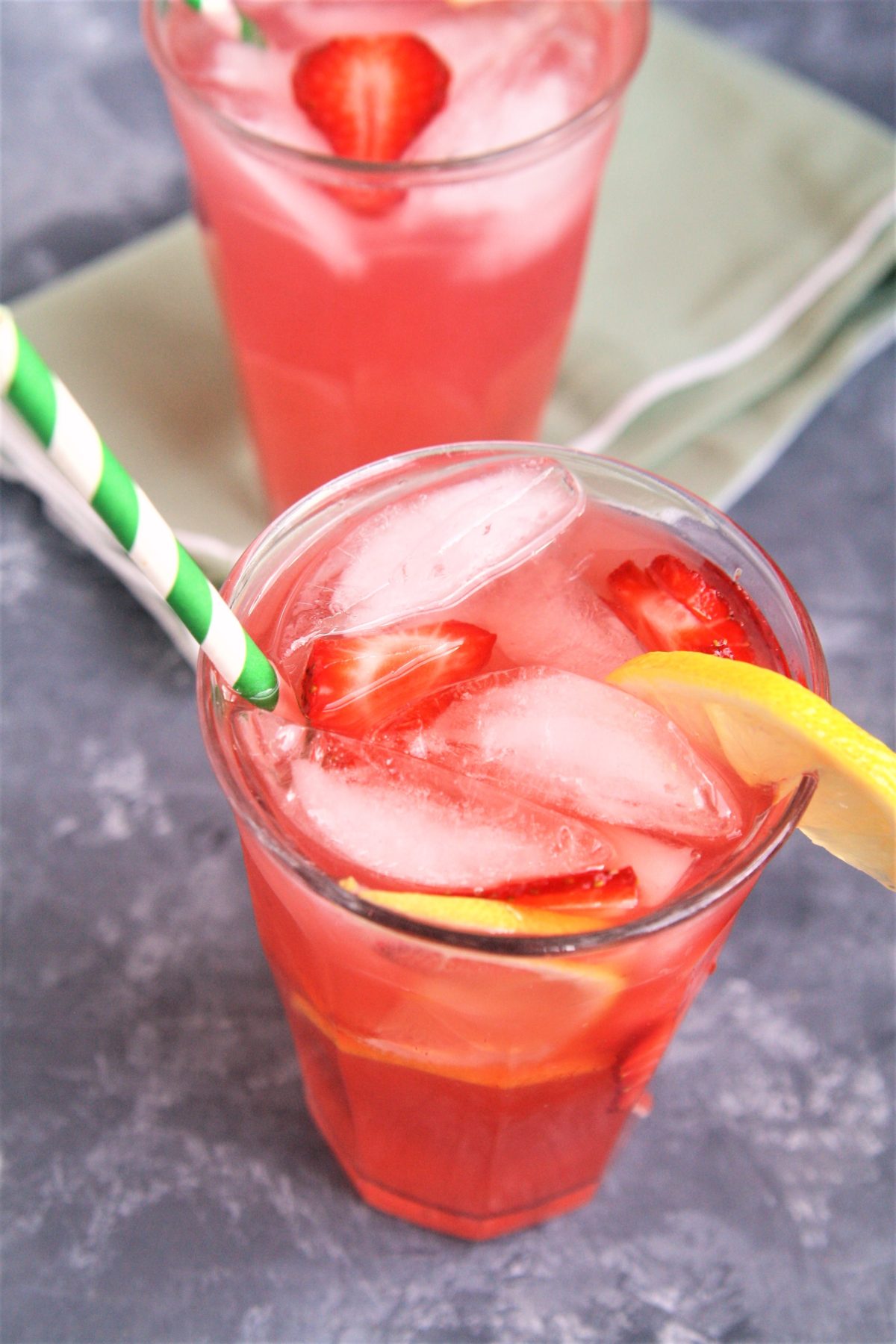 Make this Starbucks Copycat Strawberry Acai Lemonade Refresher right at home! Sweet, tangy, and thirst-quenching, it's the perfect summertime drink to cool you down on a hot day.