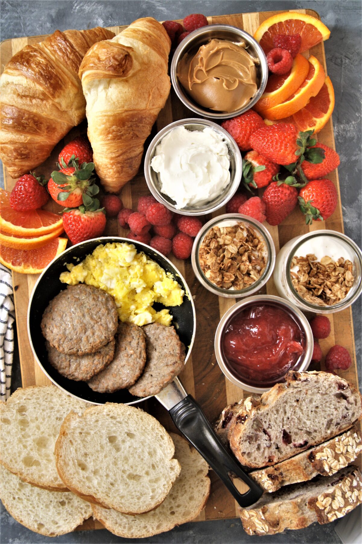Take your next breakfast or weekend brunch to the next level and serve this fun, delicious, and beautiful breakfast grazing board with a variety of favorite breakfast foods.