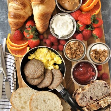 Take your next breakfast or weekend brunch to the next level and serve this fun, delicious, and beautiful breakfast grazing board with a variety of favorite breakfast foods.